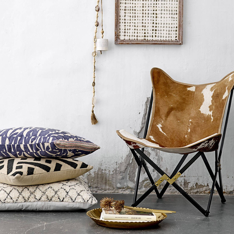 Fauteuil papillon en peau de vache design Bloomingville